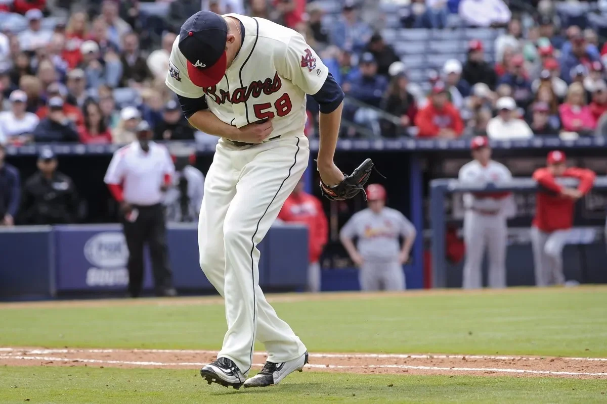 Baseball pitcher dealing with arm injury